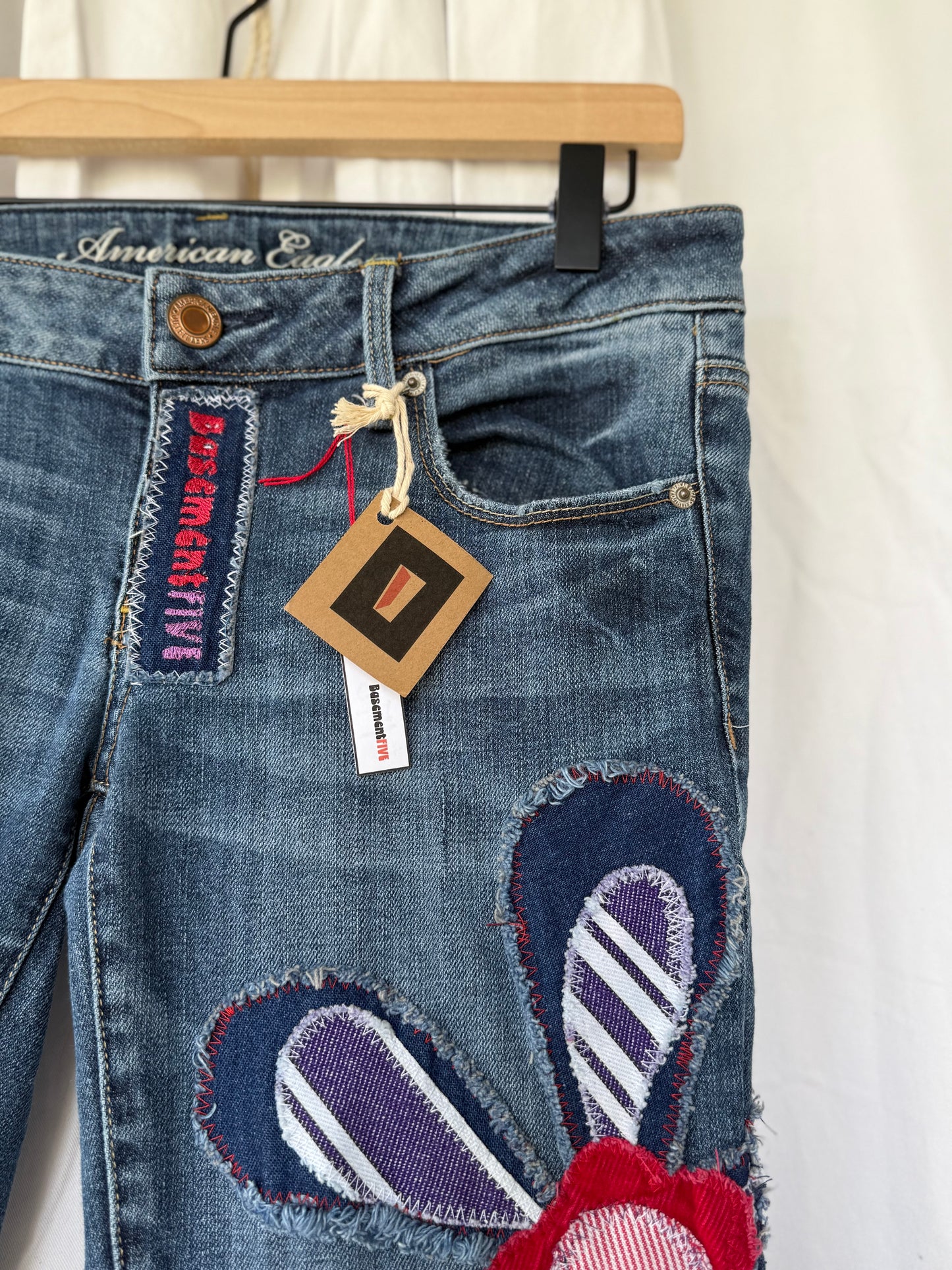 Striped Bell Bottom Jeans (size 6)– Retro Floral Appliqué