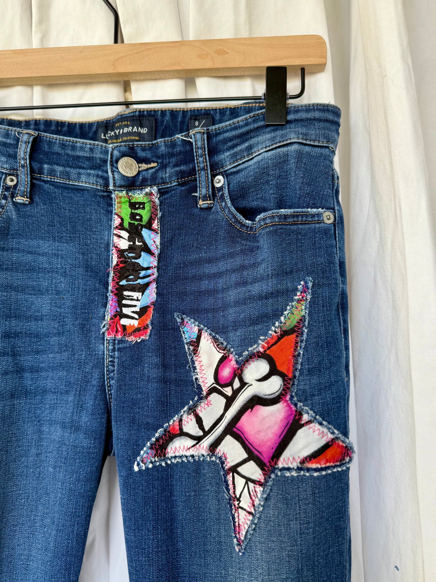 Sugar Skull Star Bell Bottom Jeans (size 8)