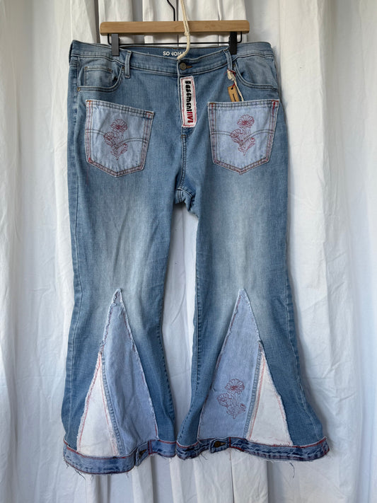 Light Wash Bell Bottom Jeans – Floral Embroidery & Raw Edge Details